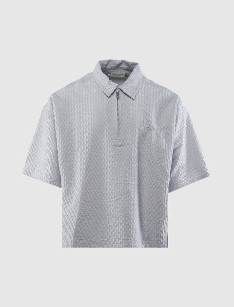 Men's grey textured short sleeve zip polo shirt on plain background