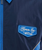 Navy blue windbreaker jacket with Honor Inc patch and car graphic on chest