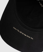 Black streetwear cap with 'Honor The Gift He Has Given You.' text under brim