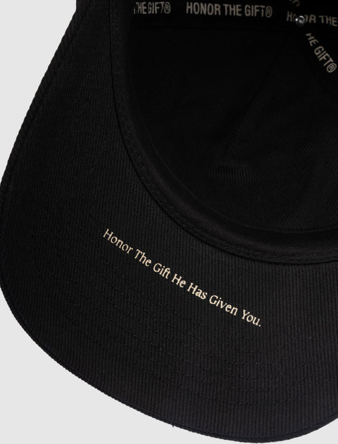 Black streetwear cap with 'Honor The Gift He Has Given You.' text under brim