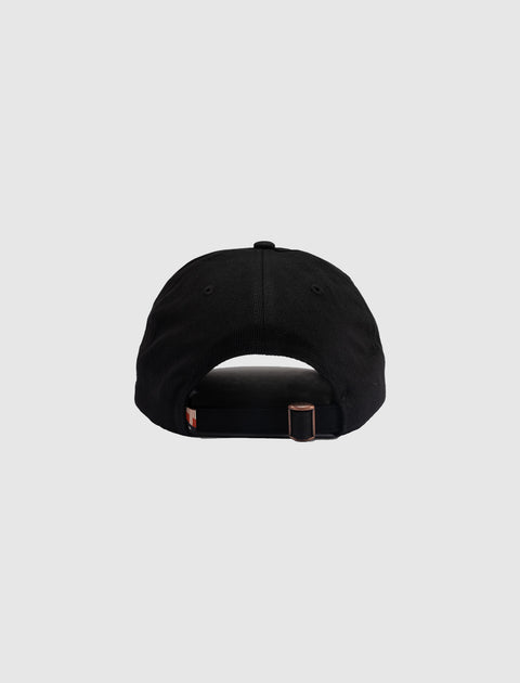 Back view of black adjustable streetwear cap with metal buckle closure on light background