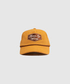 Mustard yellow streetwear baseball cap with embroidered Honor Inc patch on front