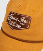 Yellow streetwear baseball cap with brown embroidered Honor Inc patch and car design