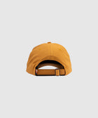 Back view of mustard yellow adjustable streetwear cap on white background