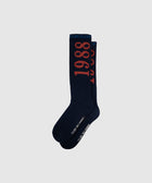 Navy crew socks with bold red '1988' text and white lettering, streetwear accessory