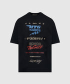 Black streetwear t-shirt with bold graphic text, racing motifs, and multicolor typography.