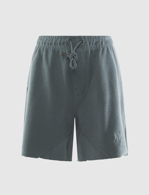 Green men's streetwear fleece shorts with drawstring waist and front pockets