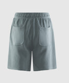 Back view of green men's streetwear shorts with elastic waistband and two rear pockets