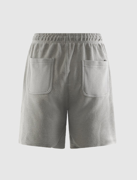 Stone grey fleece shorts with elastic waistband and two back pockets, men's streetwear