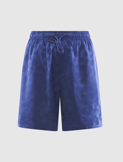Men’s blue streetwear shorts with subtle polka dot pattern and drawstring waist