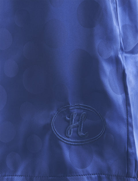 Blue streetwear fabric with embossed dots and embroidered H logo patch