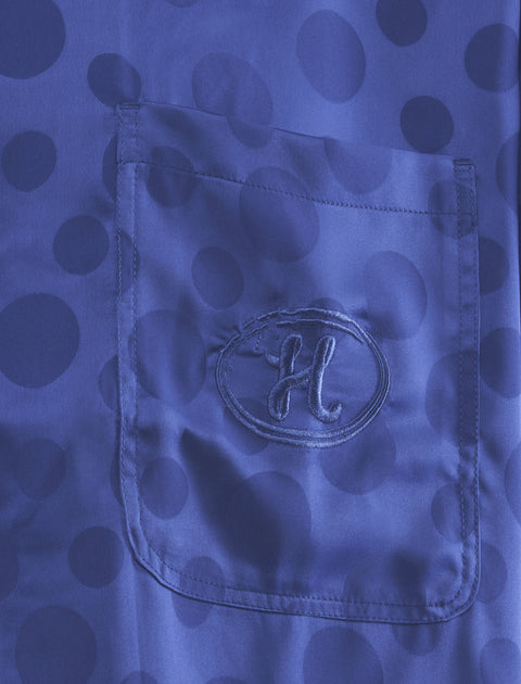 Blue polka dot shirt pocket with embroidered H logo, streetwear apparel detail