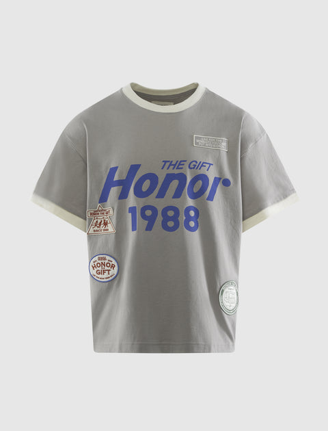 Gray men's streetwear t-shirt with blue Honor 1988 text and graphic patches on front