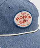 Light blue denim cap with white piping and embroidered patch reading 'Honor The Gift'.