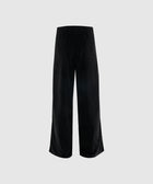 Back view of black wide-leg corduroy pants with elastic waistband and patch pockets