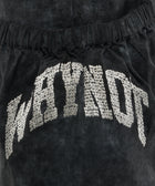 Close-up of black men's streetwear shorts with textured 'WHYNOT' embroidery and elastic waistband
