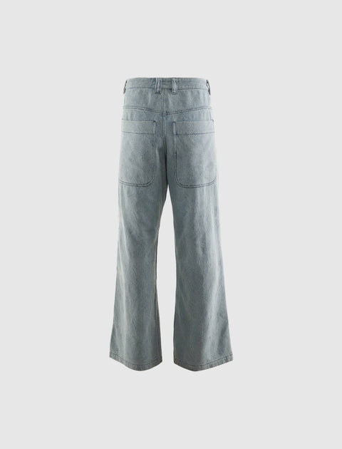 Wide-leg light wash denim jeans with back patch pockets, streetwear style