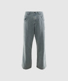 Men's light wash wide-leg jeans with subtle textured pattern, streetwear style