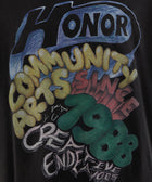 Black streetwear t-shirt with colorful bold text graphic, including HONOR, COMMUNITY ARTS, 1988.