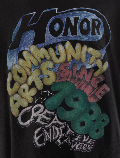 Black streetwear t-shirt with colorful bold text graphic, including HONOR, COMMUNITY ARTS, 1988.