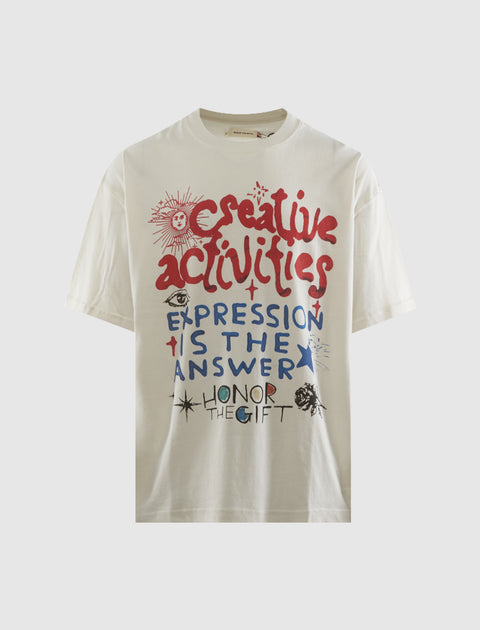 Off-white streetwear t-shirt with colorful graphic text and artistic doodles on the front