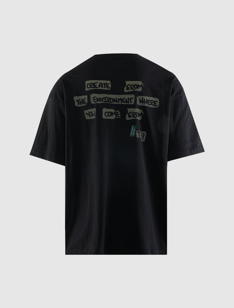 Black streetwear t-shirt with bold graffiti-style back text graphic on plain background