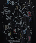Black graphic streetwear tee with abstract web pattern, collage text, and bold letter details