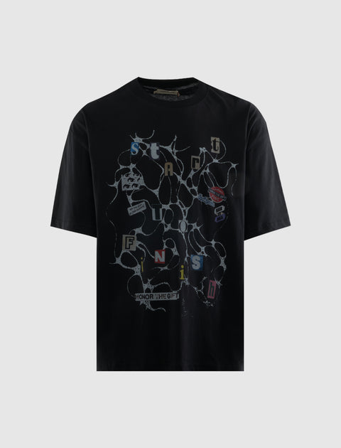Black streetwear t-shirt with graphic print, abstract design, and cut-out letter details