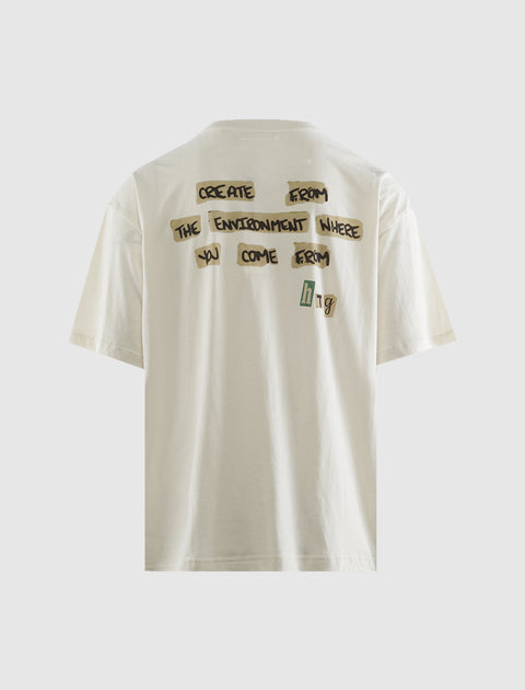 Back of a white streetwear t-shirt with bold black text graphic and short sleeves