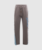 Gray streetwear jogger pants with rope drawstring, blue applique, and denim frayed side panels