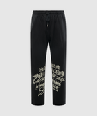 Black streetwear sweatpants with elastic waist and bold graphic lettering on lower legs