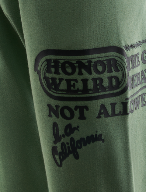 Green streetwear sweatshirt sleeve with black graphic text and LA California print