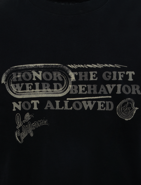 Black streetwear t-shirt with vintage text graphics, bold lettering, and scripted accents.