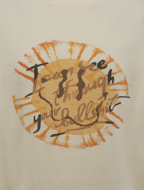 White streetwear t-shirt with orange sunburst graphic and abstract text on front
