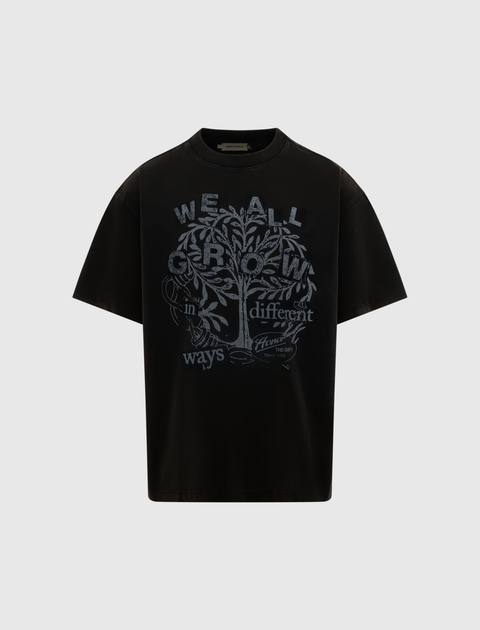 Black men's streetwear t-shirt with tree and 'We All Grow in Different Ways' graphic print