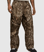 Men's relaxed fit camo pants with brown and grey tree bark pattern, streetwear style