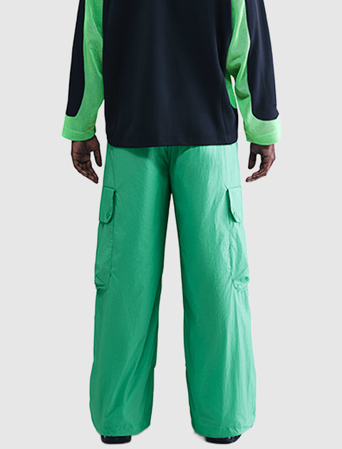 Back view of green cargo pants with wide legs and flap pockets, streetwear style