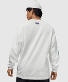Man in white long sleeve Nike shirt and knit beanie, streetwear apparel, back view