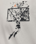 Graphic of basketball player dunking and shattering backboard on white streetwear t-shirt