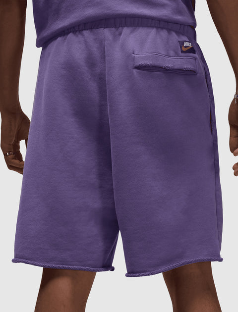 Purple men's fleece shorts with elastic waistband and back pocket, streetwear style.