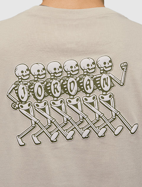 Beige streetwear shirt with graphic of walking skeletons spelling out 'Jordan' on the back