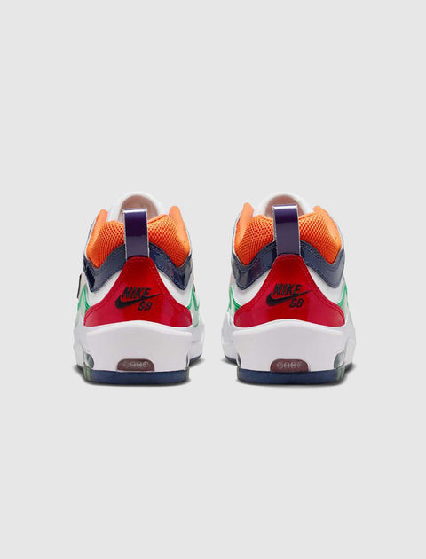 Back view of multicolor Nike SB sneakers with red, orange, green, and navy accents