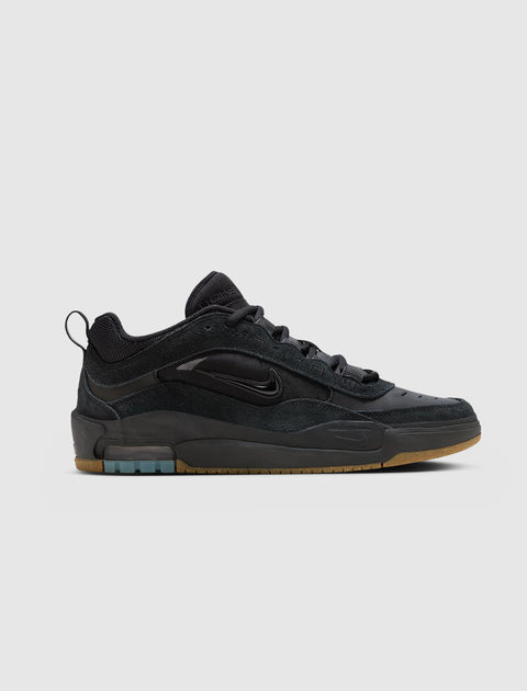 Black low-top sneaker with suede and mesh panels, gum sole, and side swoosh logo.