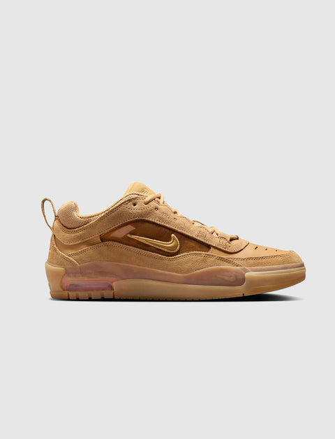 Tan low top sneaker with suede upper, visible air sole, and side swoosh logo on white background