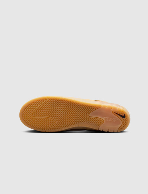 Gum sole skate shoe outsole with herringbone tread pattern and Nike Swoosh logo