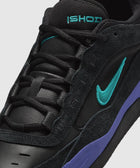 Black sneaker with teal logo, purple midsole, mesh tongue, and suede accents, close-up view