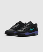 Black and purple low-top sneakers with teal Swoosh and visible air sole on a white background