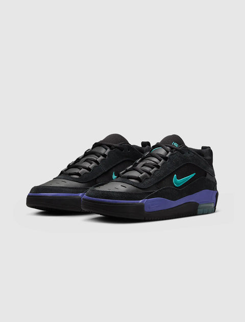 Black and purple low-top sneakers with teal Swoosh and visible air sole on a white background