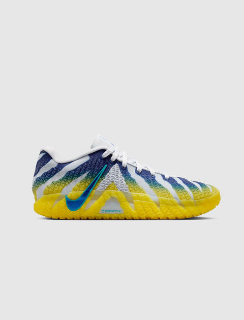 Men's sneaker with blue, white, and yellow gradient design, textured sole, side view