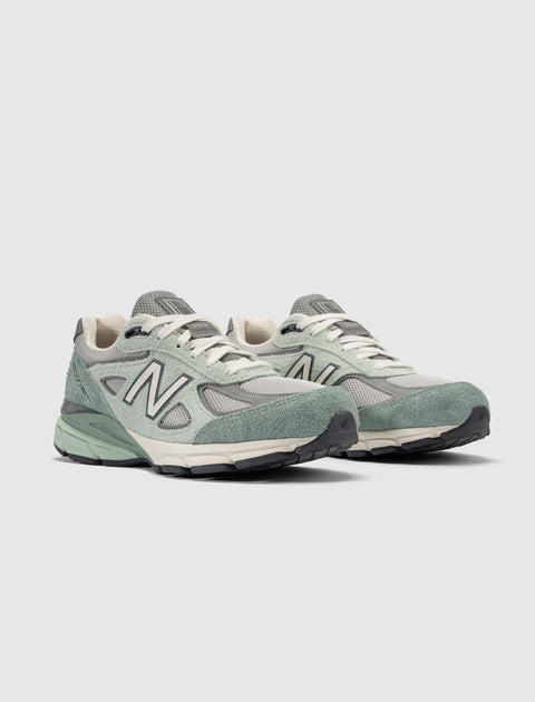 Men's New Balance 990v4 sneakers in green suede and mesh, side and front view